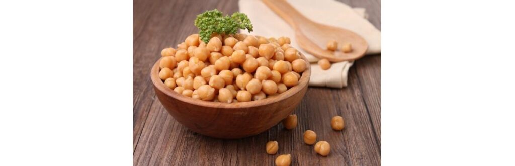 wooden-bowl-overflowing-with-chickpeas-topped-with-parsley-picture-id137302332 (1)