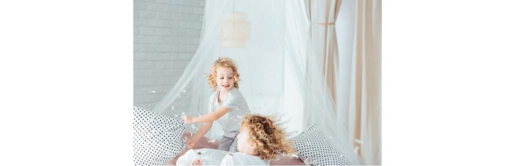 siblings-having-pillow-fight-picture-id656169154