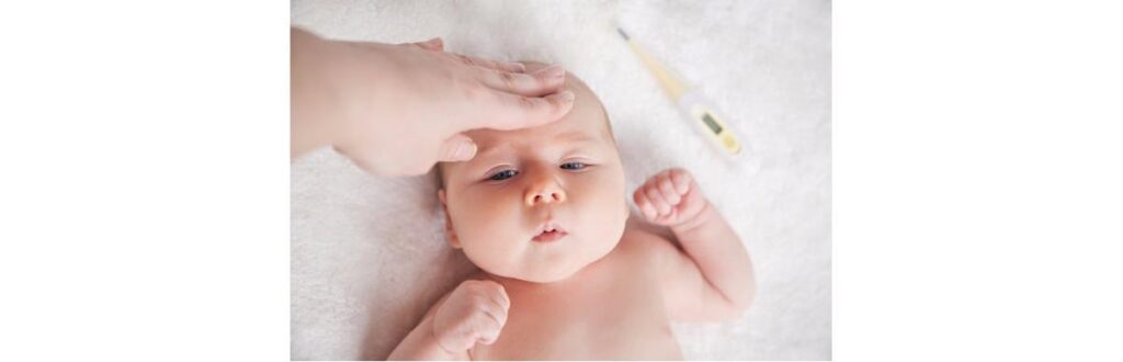 mother-checks-the-temperature-of-a-sick-baby-picture-id610051046