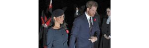 Meghan optou com um vestido azul marinho com um cinto acima da cintura para marcar a barriga