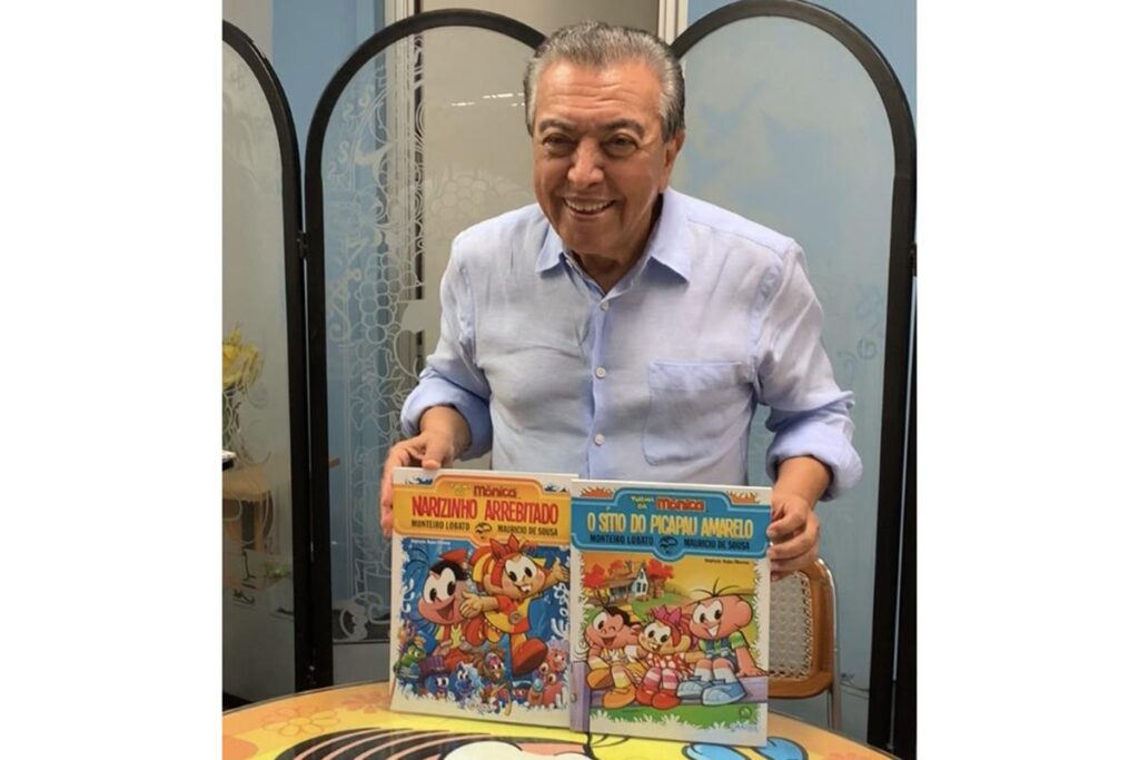 Mauricio de Sousa com a Turma da Mônica e o livro Sítio do Pica-Pau Amarelo e a edição da Pais&Filhos de abril, ambas ilustrada por ele