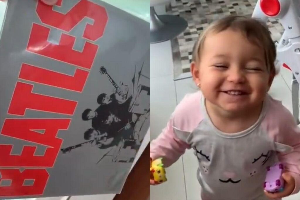 A bebê pede insistentemente para que o pai coloque Beatles