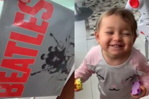 A bebê pede insistentemente para que o pai coloque Beatles