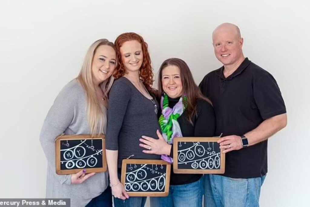 Sam segurando Starla ao lado da irmã Nikkita