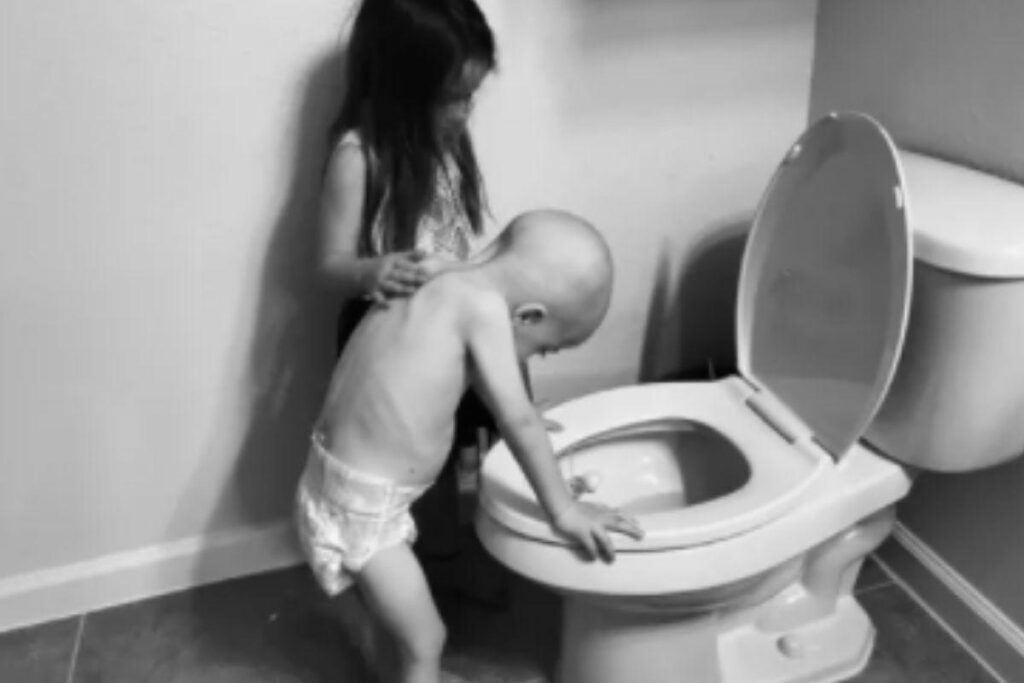 Beckett Burge com a irmã, Aubrey, passando mal após uma sessão de quimioterapia