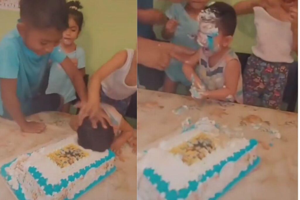 Criança dormindo no colo da mãe enquanto outras pessoas cantam parabéns