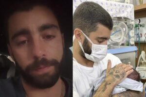 Pedro com a filha caçula, Aurora, em seu colo