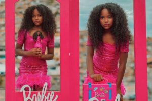 Menina se fanrasia de Barbie para sessão de fotos