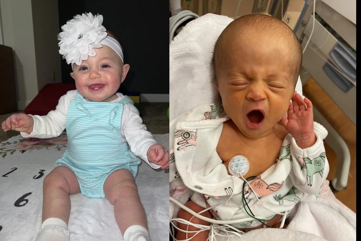 Bebê com laço na cabeça . Bebê recém-nascido na cama de hospital