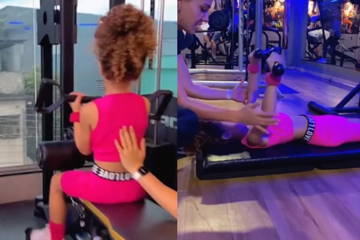 menina de 6 anos fazendo treino de musculação na academia
