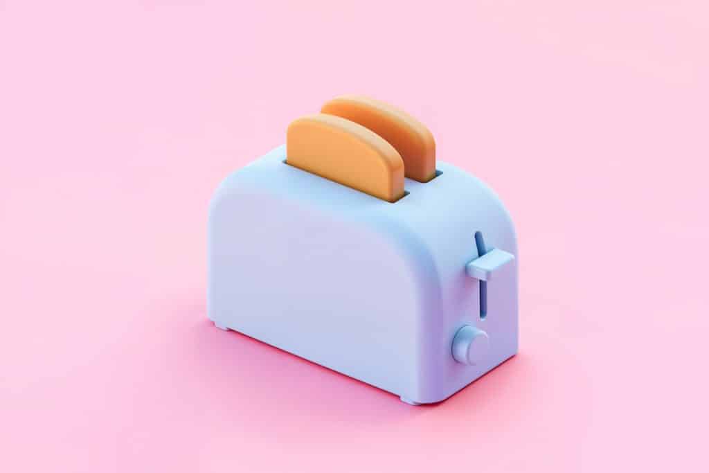 Torradeira azul arredondada com dois pães em um fundo rosa.